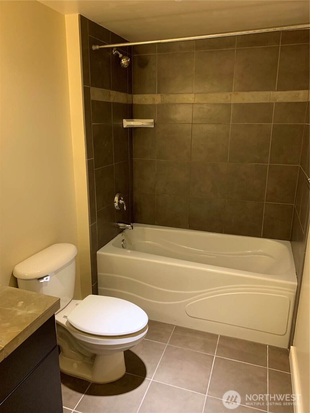 819 Virginia Street, Unit 2808 Seattle, WA 98101 - Photo 20 of 34 a bathroom with a toilet and a shower