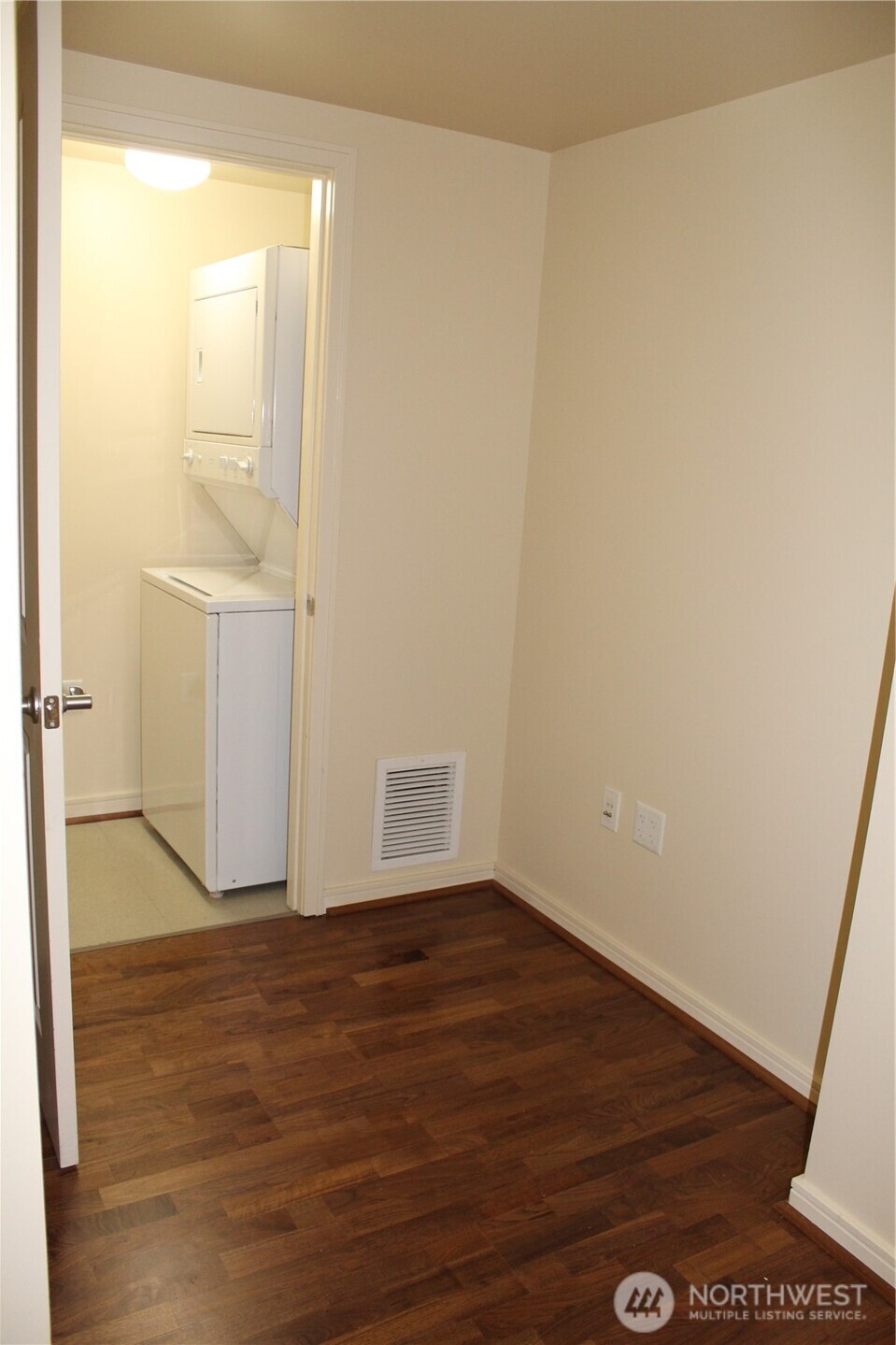 819 Virginia Street, Unit 2808 Seattle, WA 98101 - Photo 22 of 34 a view of an empty room with wooden floor and a window