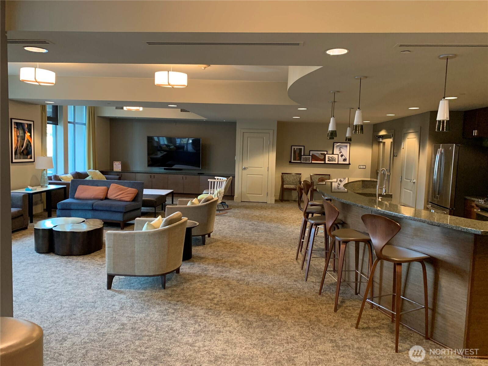 819 Virginia Street, Unit 2808 Seattle, WA 98101 - Photo 25 of 34 a living room with furniture a flat screen tv and a large window
