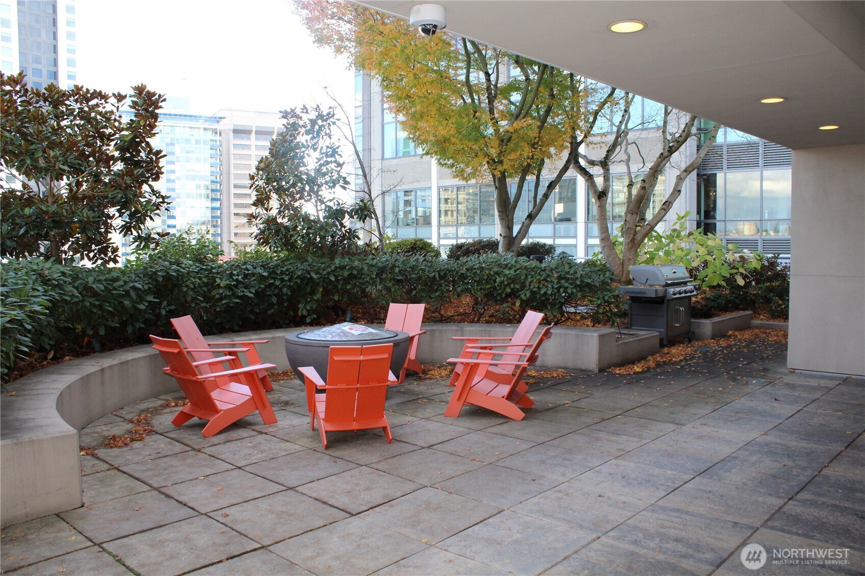 819 Virginia Street, Unit 2808 Seattle, WA 98101 - Photo 30 of 34 a backyard of a house with outdoor seating
