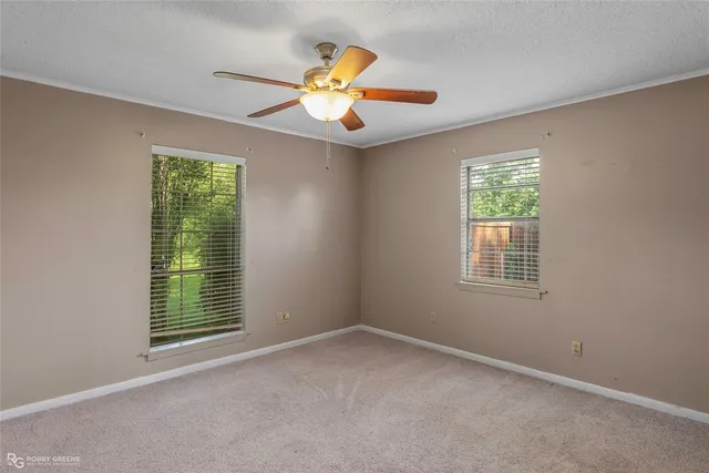 a bathroom with a granite countertop sink and mirror