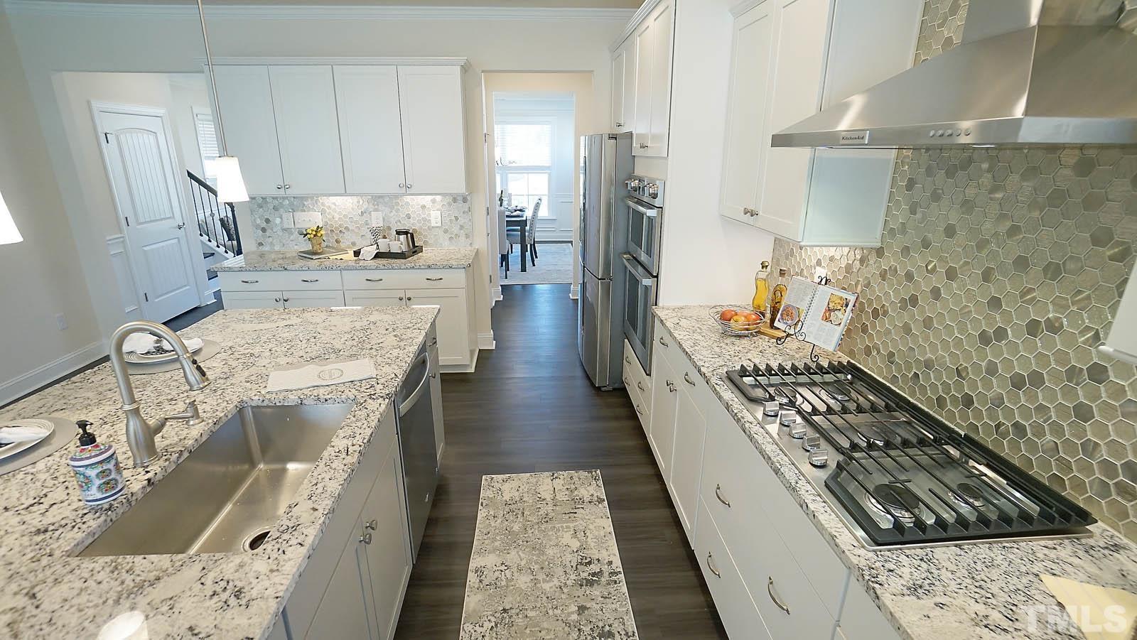 620 Trocha Drive Cary, NC 27513 - Photo 13 of 44 a view of a kitchen with sink and furniture