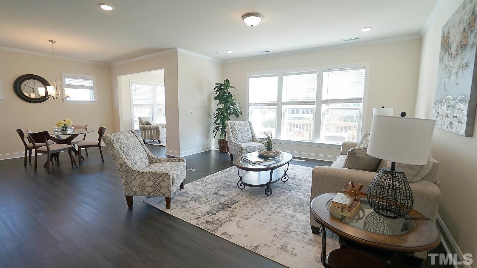 620 Trocha Drive Cary, NC 27513 - Photo 16 of 44 a living room with furniture and a large window