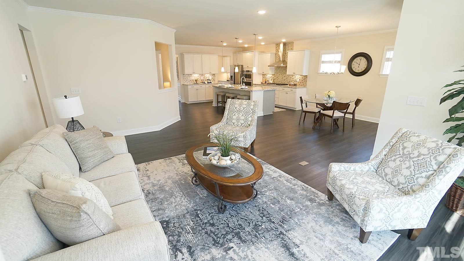 620 Trocha Drive Cary, NC 27513 - Photo 17 of 44 a living room with furniture and wooden floor