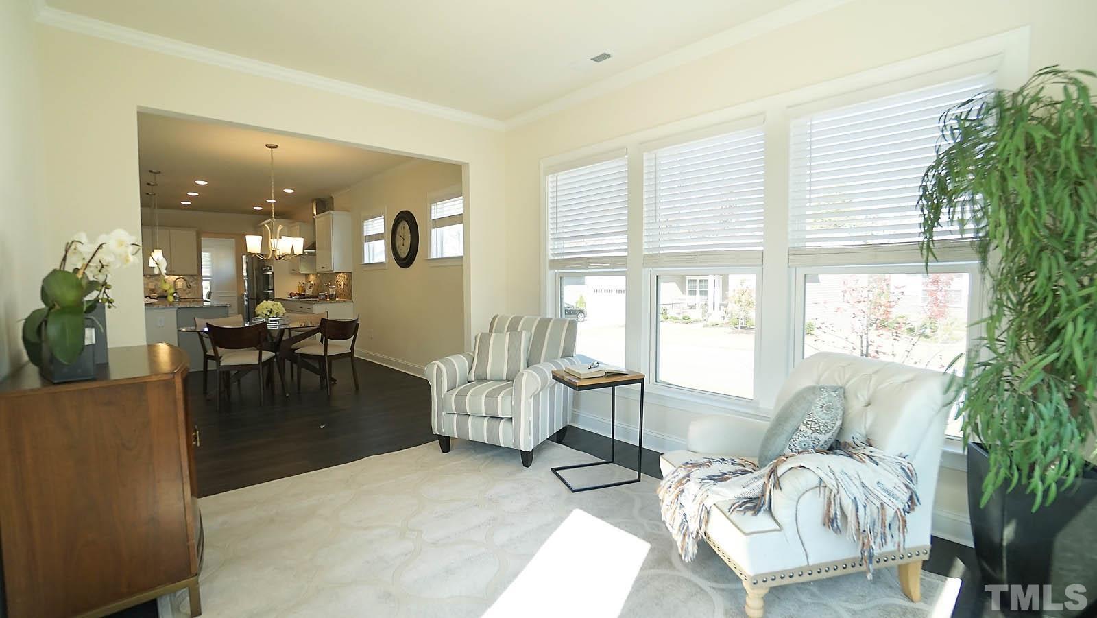 620 Trocha Drive Cary, NC 27513 - Photo 23 of 44 a living room with furniture and a large window