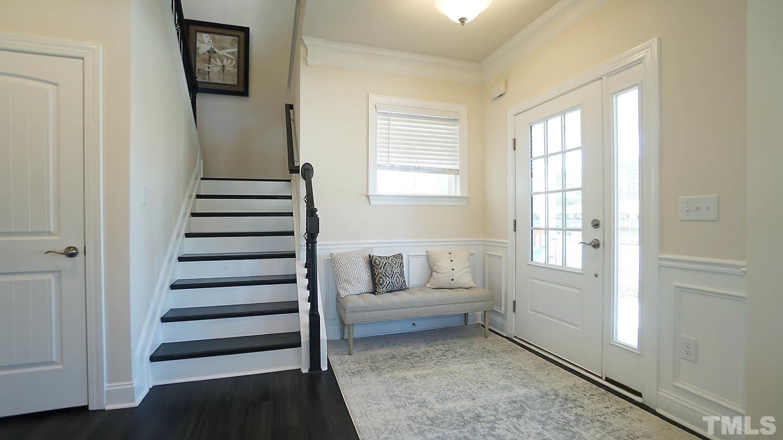 620 Trocha Drive Cary, NC 27513 - Photo 7 of 44 a view of entryway with stairs and wooden floor