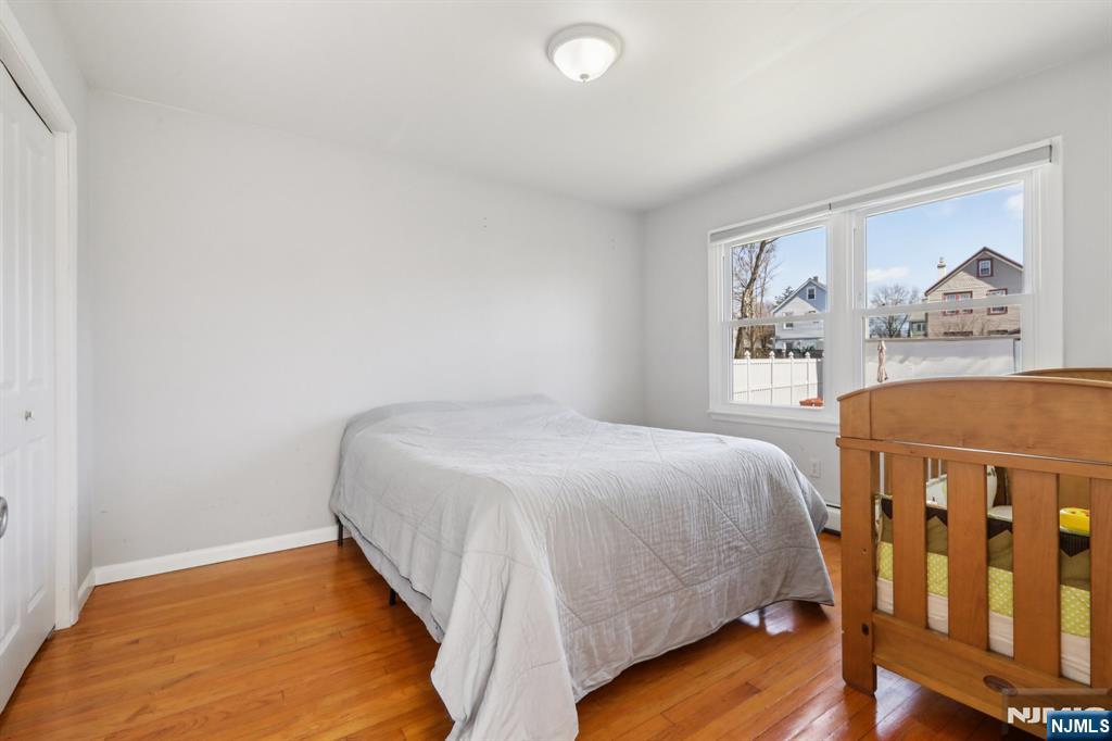 22 Treptow Street Little Ferry, NJ 07643 - Photo 19 of 44 a bedroom with a bed and a window