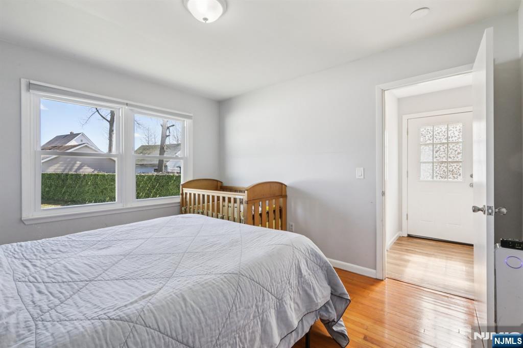 22 Treptow Street Little Ferry, NJ 07643 - Photo 20 of 44 a bedroom with a bed and a window