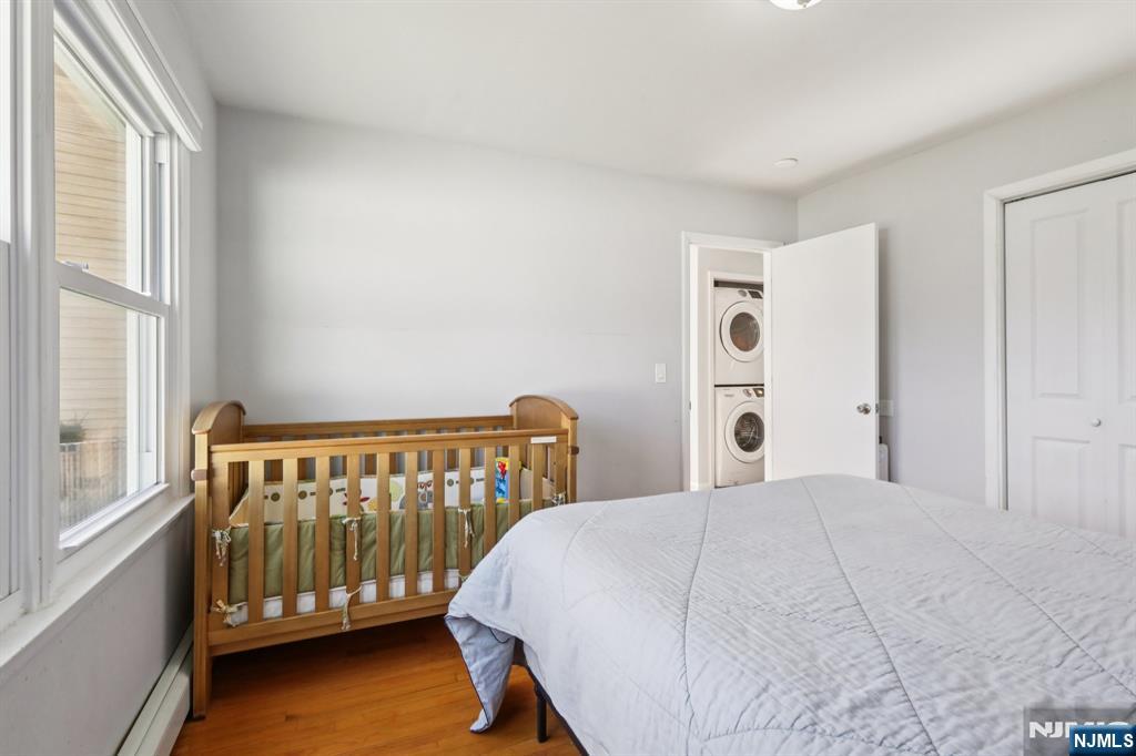 22 Treptow Street Little Ferry, NJ 07643 - Photo 21 of 44 a bedroom with a bed and a window