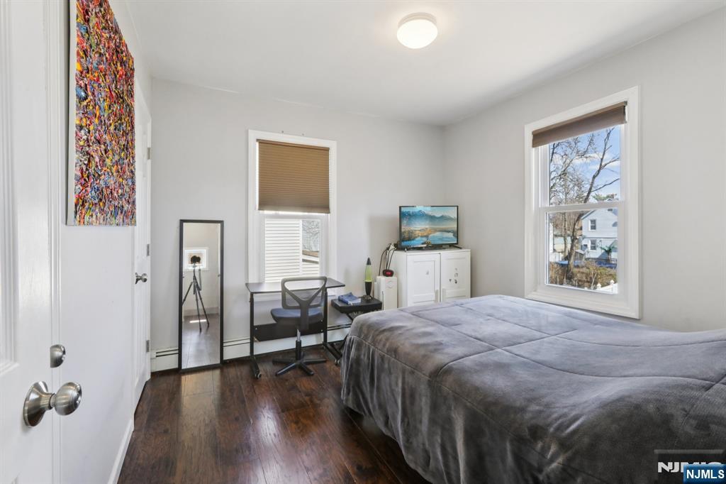 22 Treptow Street Little Ferry, NJ 07643 - Photo 26 of 44 a bedroom with a bed and a table in it