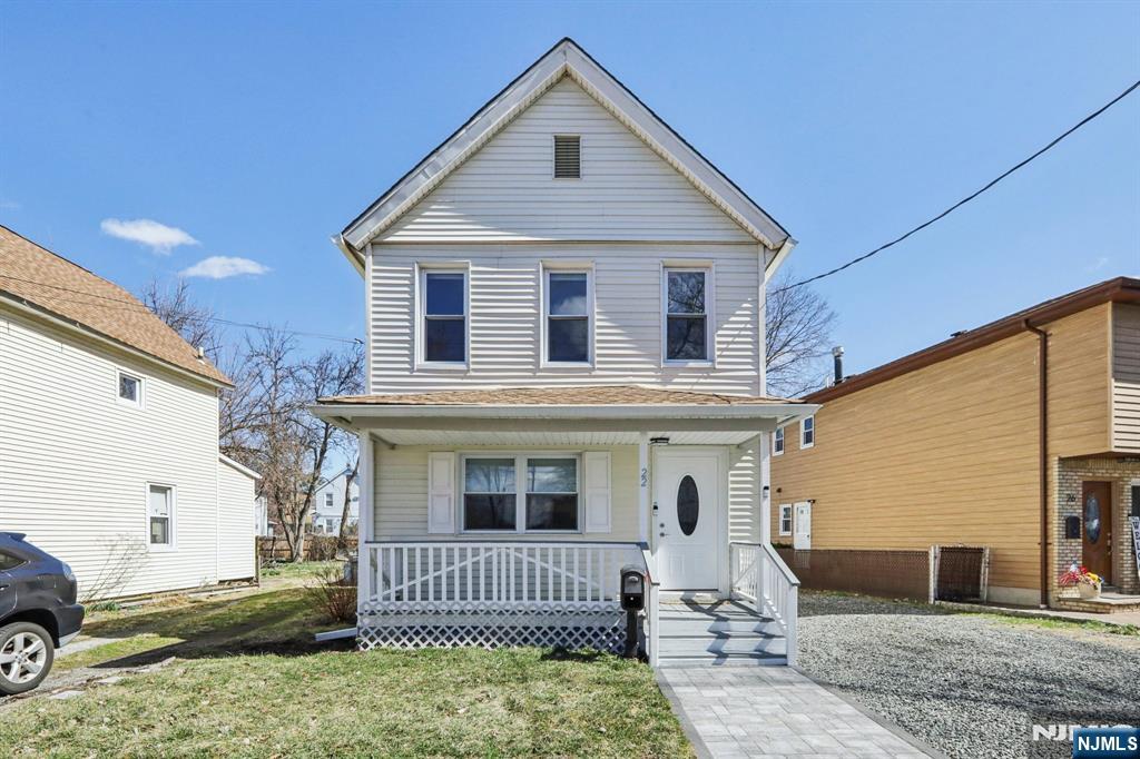 22 Treptow Street Little Ferry, NJ 07643 - Photo 3 of 44 a front view of a house with a yard