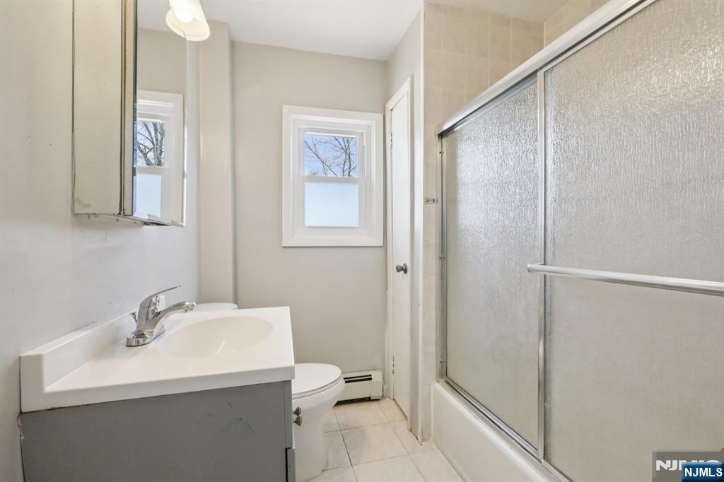 22 Treptow Street Little Ferry, NJ 07643 - Photo 32 of 44 a bathroom with a sink toilet and shower