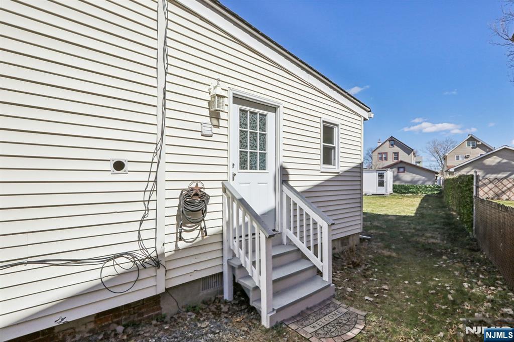 22 Treptow Street Little Ferry, NJ 07643 - Photo 33 of 44 a view of a house with a yard and stairs