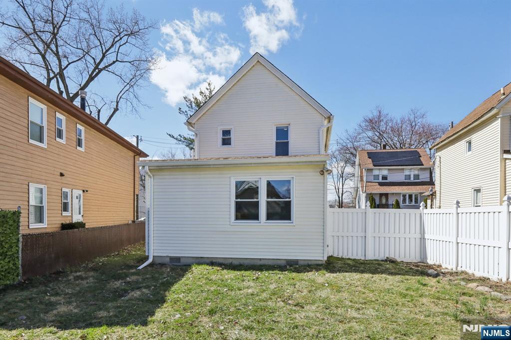 22 Treptow Street Little Ferry, NJ 07643 - Photo 37 of 44 a front view of a house with a yard