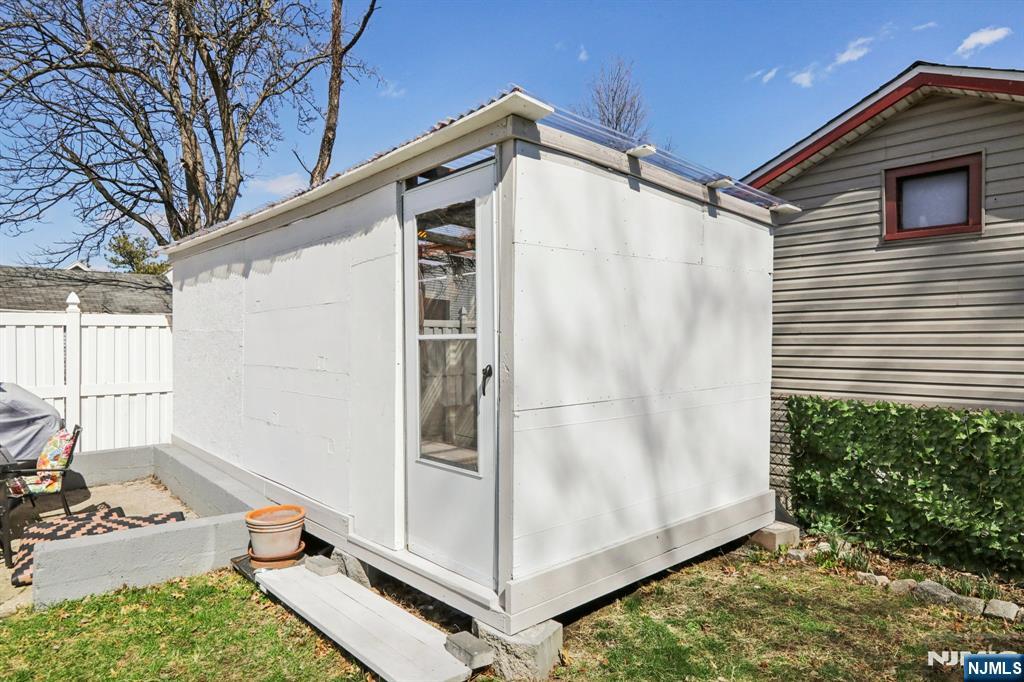 22 Treptow Street Little Ferry, NJ 07643 - Photo 39 of 44 a backyard of a house with seating space