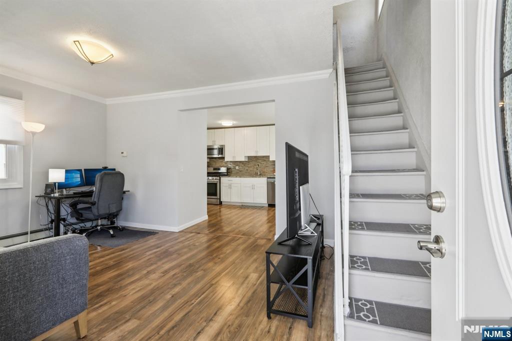 22 Treptow Street Little Ferry, NJ 07643 - Photo 5 of 44 a view of a workspace with furniture and wooden floor