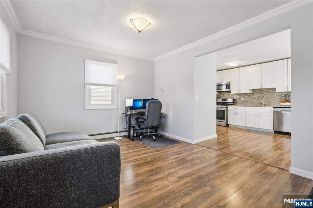 22 Treptow Street Little Ferry, NJ 07643 - Photo 7 of 44 a living room with furniture and a window