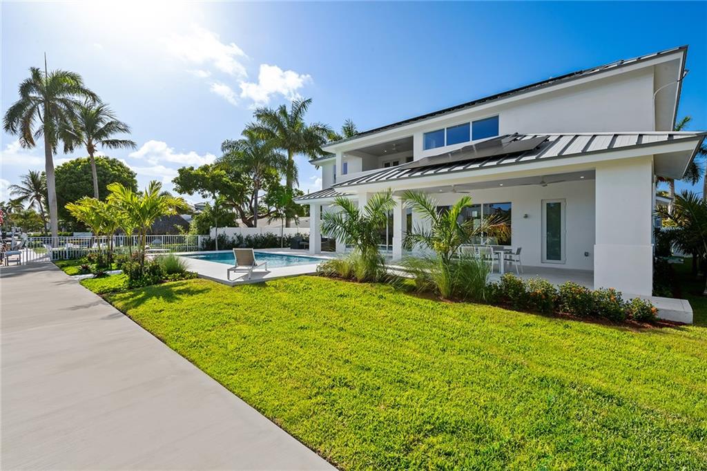 3204 Dover Road Pompano Beach, FL 33062 - Photo 31 of 73 a front view of a house with garden
