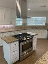 11792 Farrell Road Willis, TX 77378 - Photo 7 of 16 a stove top oven sitting inside of a kitchen