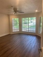 11792 Farrell Road Willis, TX 77378 - Photo 10 of 16 an empty room with wooden floor and windows