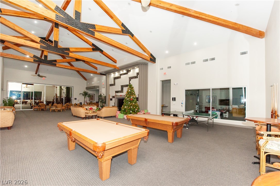 9050 West Warm Springs Road, Unit 1132 Las Vegas, NV 89148 - Photo 20 of 21 A spacious community lounge features a vaulted ceiling with exposed wooden beams, providing ample room for recreation and social gatherings.