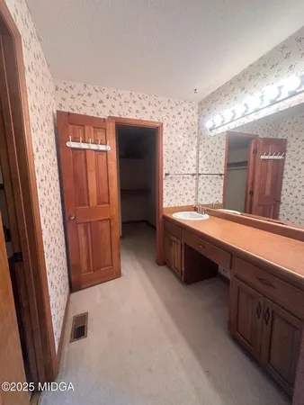 a bathroom with a double vanity sink and a bathtub