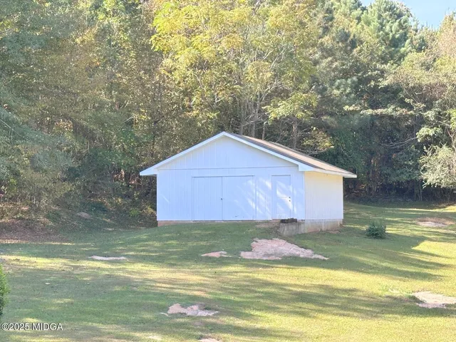 a view of a backyard of the house