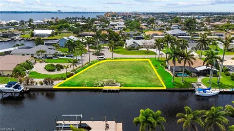 an aerial view of a residential houses with outdoor space and swimming pool