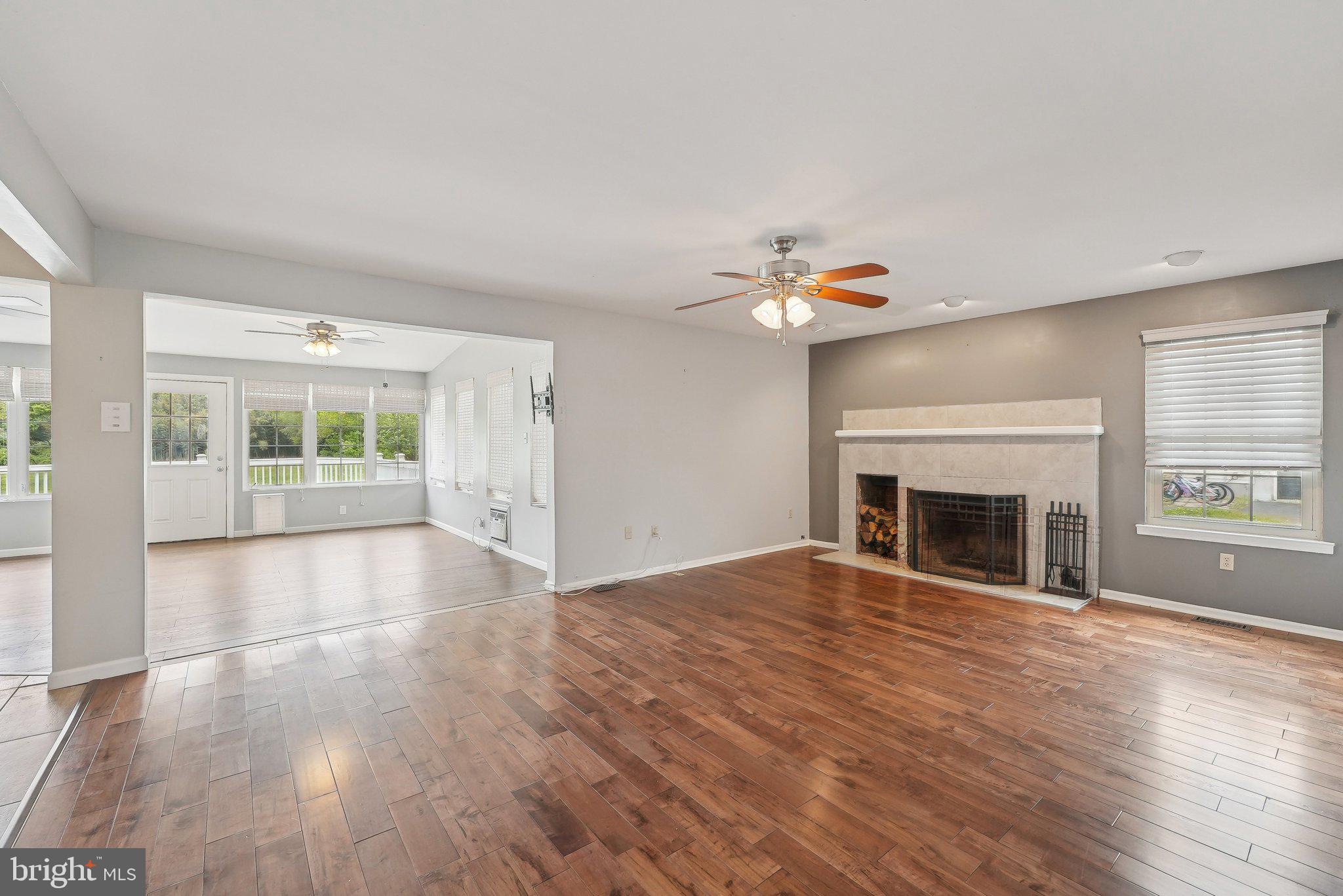 317 Clems Run Mullica Hill, NJ 08062 - Photo 14 of 33 a view of empty room with wooden floor and fireplace
