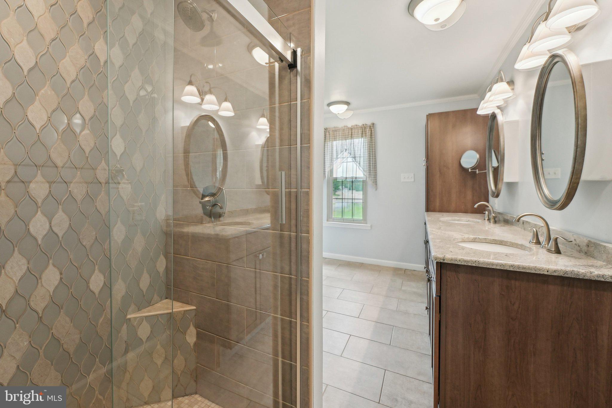 317 Clems Run Mullica Hill, NJ 08062 - Photo 20 of 33 a bathroom with a double vanity sink mirror and shower