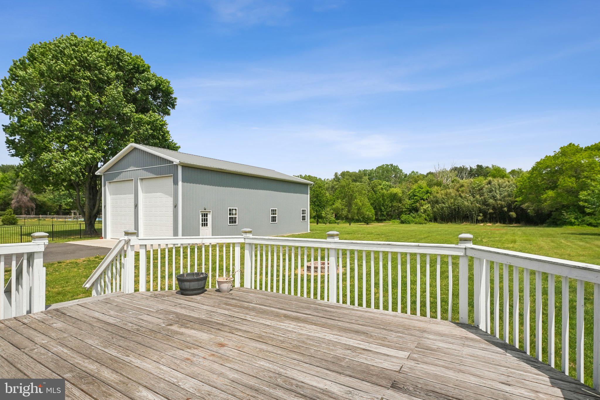 317 Clems Run Mullica Hill, NJ 08062 - Photo 28 of 33 a view of a wooden deck and a yard