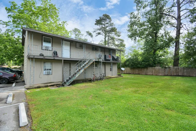 a backyard of a house with lots of green space