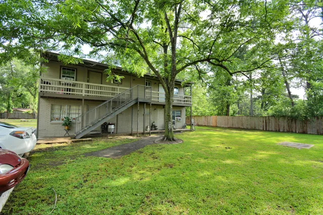 a view of a backyard with a small cabin