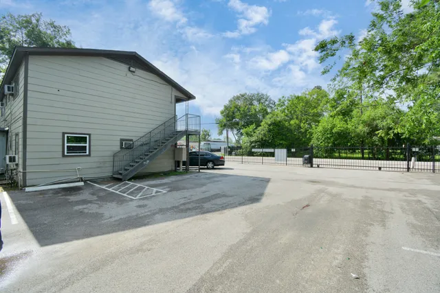 a view of street along with residential houses