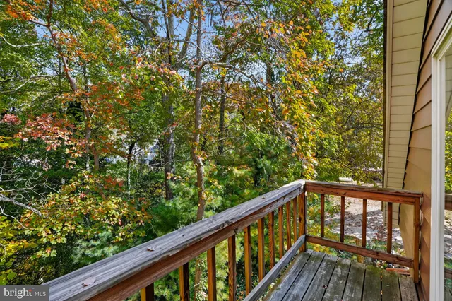 a view of balcony with wooden floor