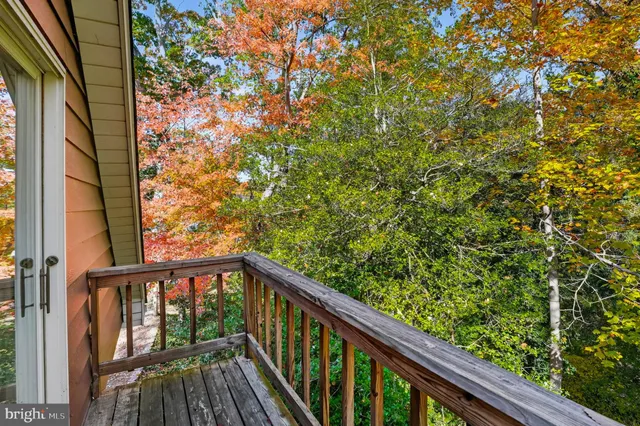 a view of a balcony with wooden floor