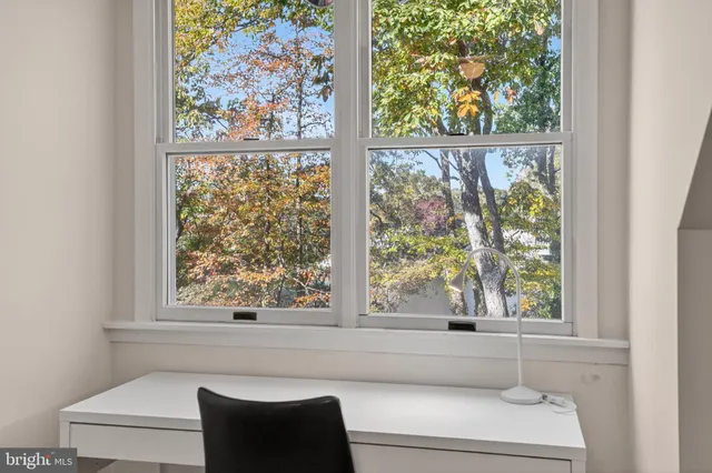 a bathroom with a bathtub and window