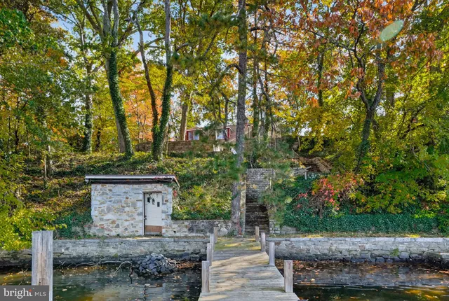 a view of house with trees in the background