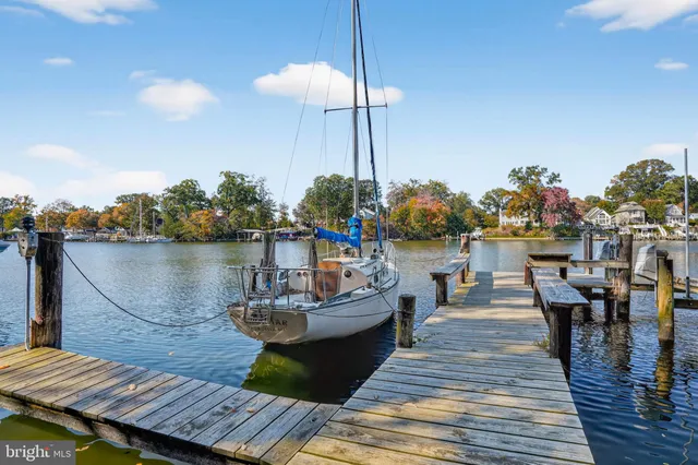 a view of a balcony with chairs and wooden floor