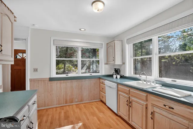 a kitchen with granite countertop a sink and a window
