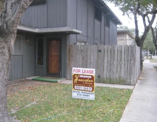 a sign that is on the side of the house