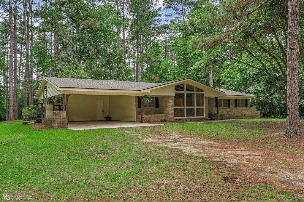 2552 Jack Martin Road Minden, LA 71055 - Photo 1 of 1 a front view of a house with a yard