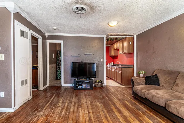 a kitchen with stainless steel appliances granite countertop a sink and cabinets