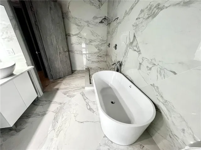 a bathroom with a bathtub and toilet