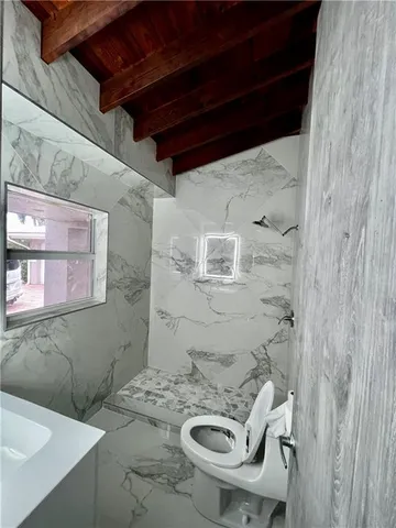 a bathroom with a sink and a toilet