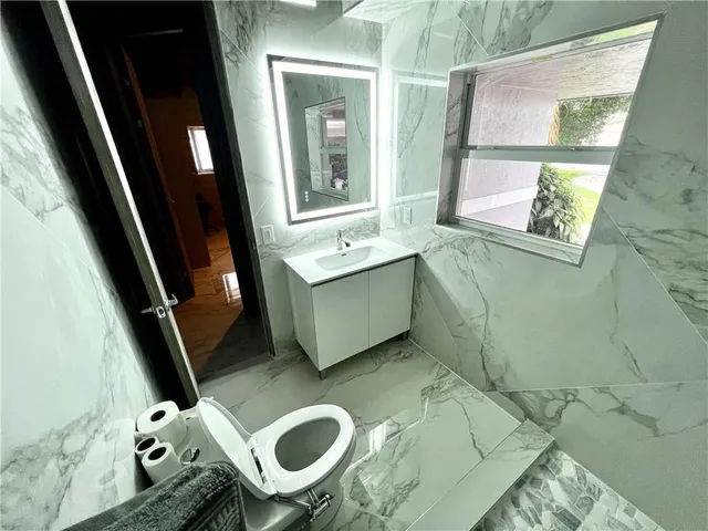 a bathroom with a sink and mirror