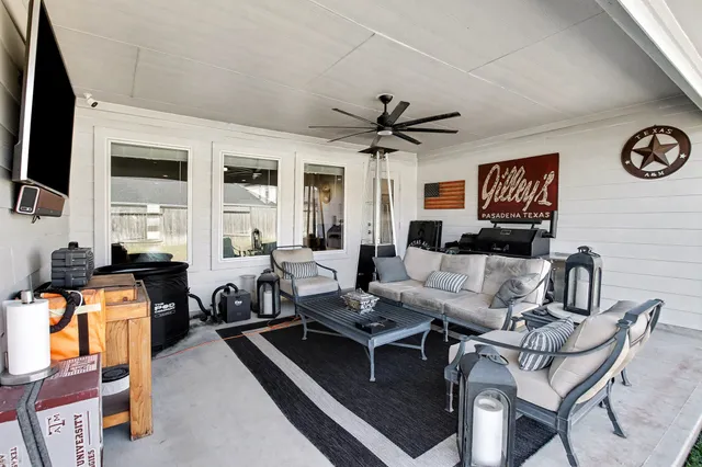 a living room with furniture and a flat screen tv