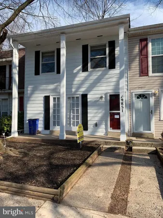 a front view of a house with yard