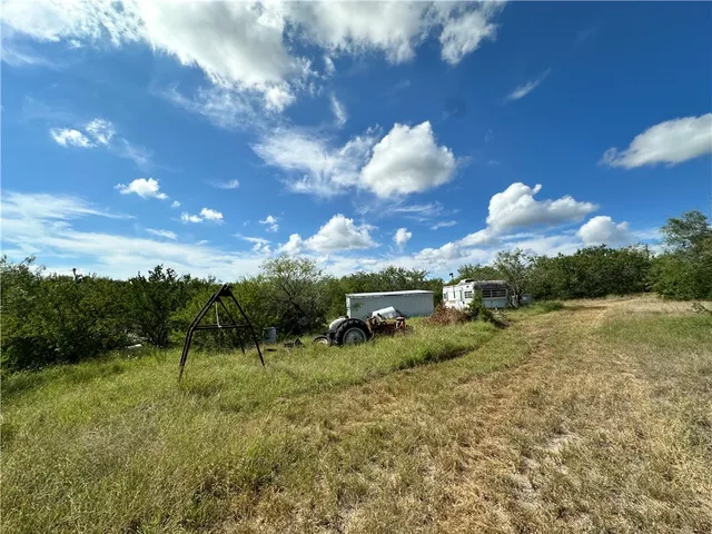 a backyard of a house with lots of green space