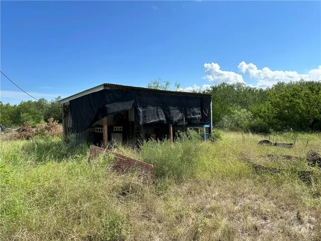 a backyard of a house with lots of trees